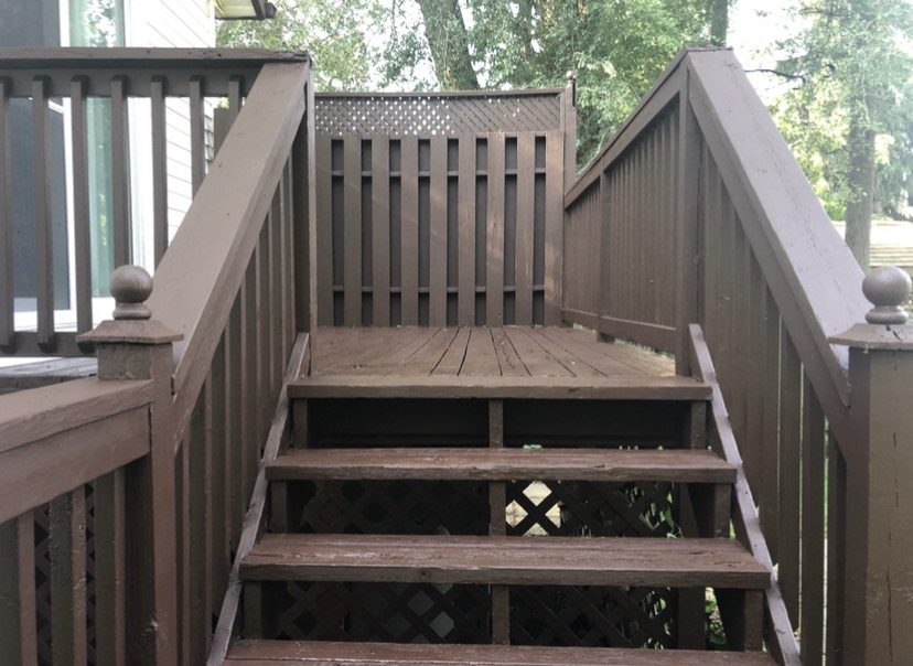 A refurbished wooden deck, rejuvenated by Prep'n Sell's decking solutions, showcasing quality craftsmanship.