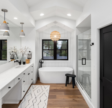 A newly renovated modern bathroom with updated fixtures and elegant design by Prep'n Sell.