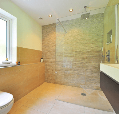 Accessibility upgrades in a bathroom by Prep'n Sell, including support bars and non-slip surfaces.