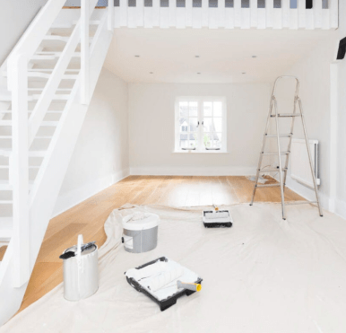 An interior space being painted by a professional, ensuring a smooth and even application.
